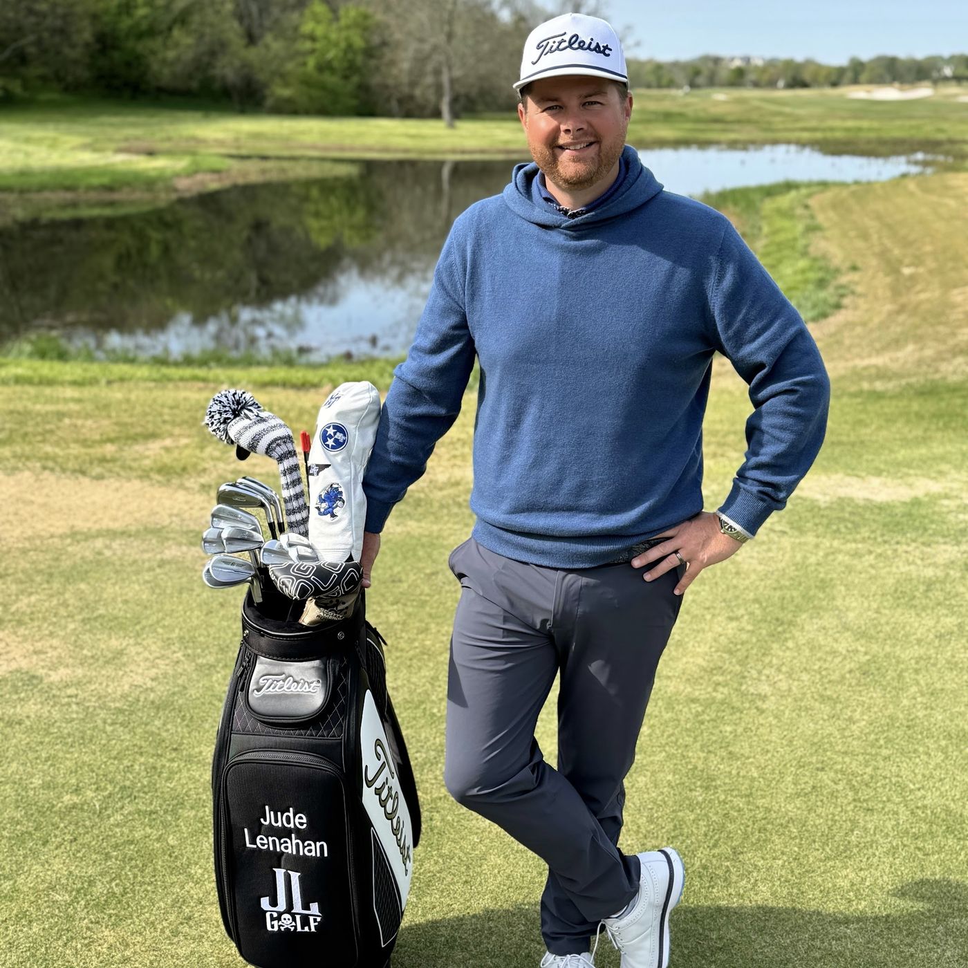 Jude Lenahan standing beside his Titleist tour staff bag at the course